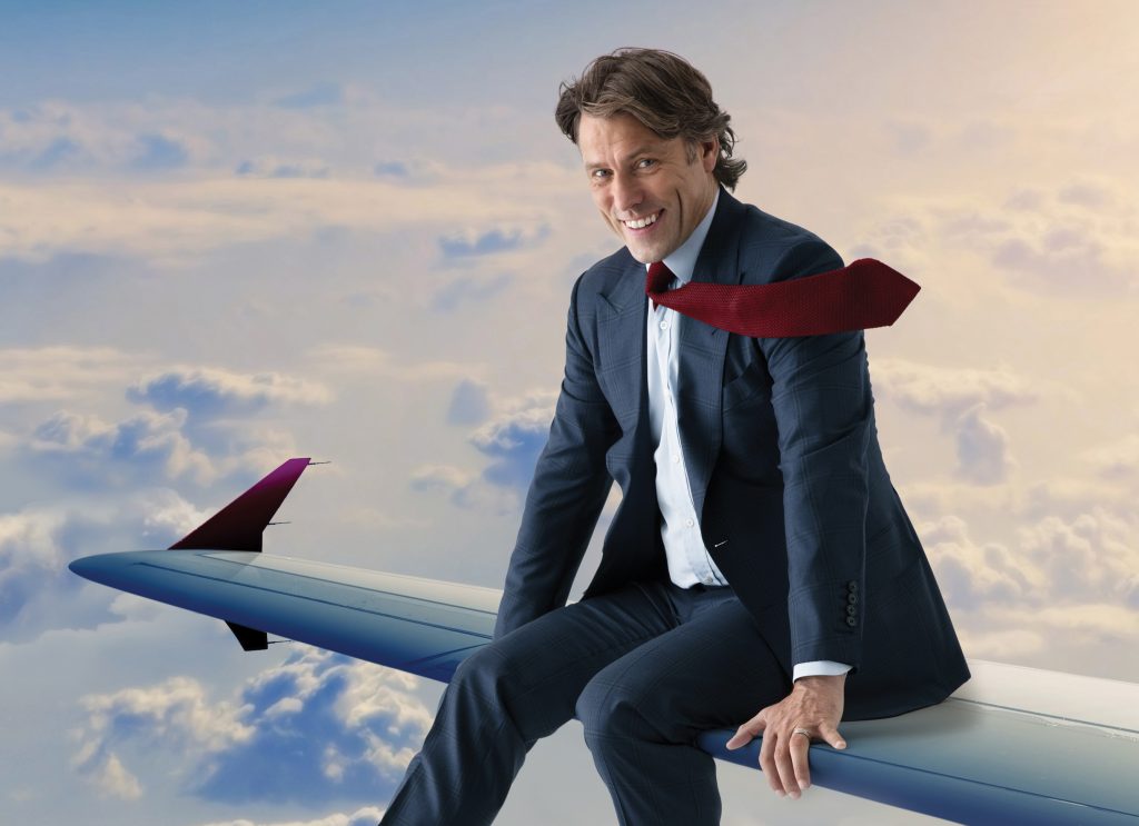 John Bishop on a plane wing