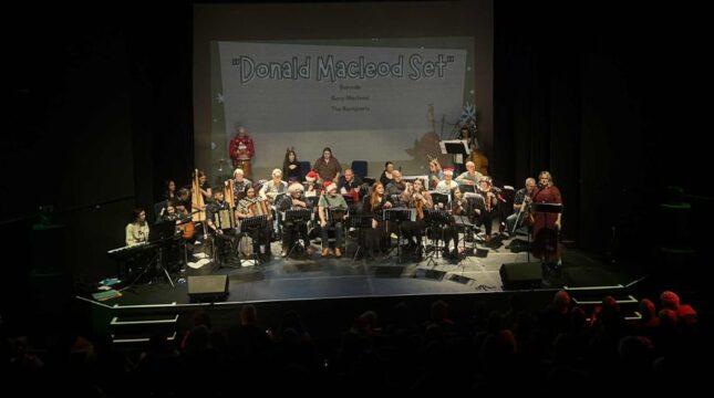 Westerns Isles Trad Orchestra in their 2025 debut concert at An Lanntair, Arts Centre, Stornoway featuring several band members in Santa hats and Christmas jumpers